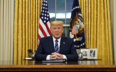 U.S. President Trump speaks about the U.S response to the COVID-19 coronavirus pandemic during an address to the nation from the Oval Office of the White House