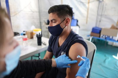 Orange County firefighter Christopher Huerta, 31, receives the coronavirus disease (COVID-19) vaccine in Irvine