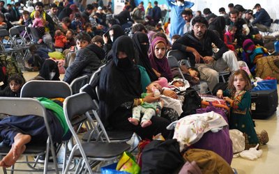 Afghan refugees are processed inside Hangar 5 at Ramstein Air Base in Germany