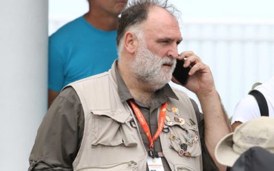 Jose Enrique, Founder of World Kitchen Central, speaks on a cellphone  at Odyssey Aviation in Nassau, Bahamas