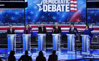Candidates try to speak near the conclusion of the ninth Democratic 2020 U.S. presidential debate at the Paris Theater in Las Vegas, Nevada, U.S.,