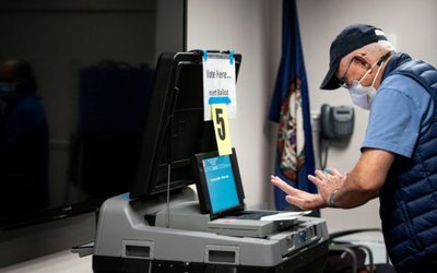 FILE PHOTO: People vote at an early voting site in Fairfax, Virginia