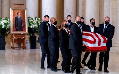 The flag-draped casket of Justice Ruth Bader Ginsburg arrives in the Great Hall at the Supreme Court in Washington