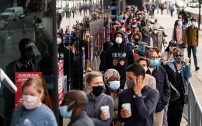 Voters line up to cast ballots on the first day of early voting in New York
