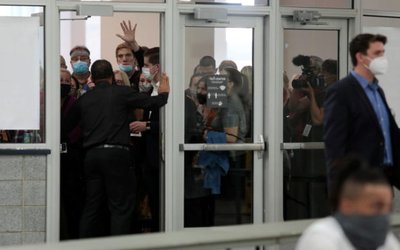 GOP poll challengers react after being asked to leave due to room capacity at the TCF Center after Election Day in Detroit, Michigan