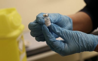 FILE PHOTO: People get injections of Pfizer-BioNTech COVID-19 vaccine in Wolverhampton