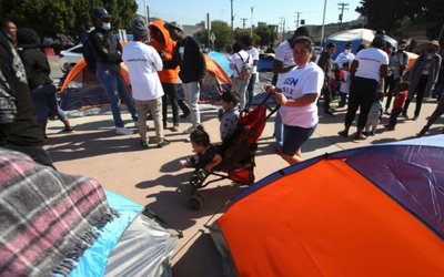 Migrants from Central America camp outside the El Chaparral border crossing, hoping to cross and request asylum in the U.S, in Tijuana,
