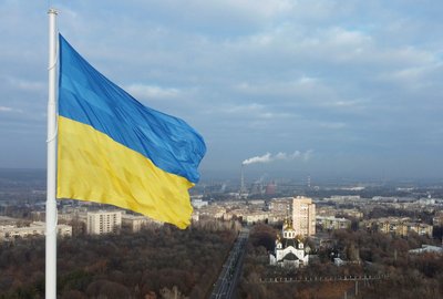 The national flag of Ukraine flies over the town of Kramatorsk