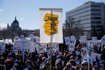 Striking Minneapolis teachers rally outside of the MN State Capitol