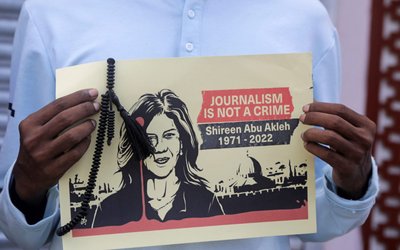 Journalists hold placards depicting Al Jazeera reporter Sireen Abu Akleh during a protest in Mogadishu