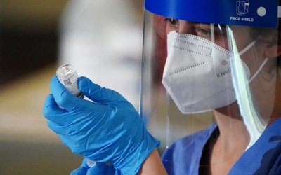 FILE PHOTO: Workers of the FDNY EMS receive COVID-19 Moderna vaccine in New York