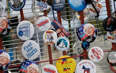 A collection of pins are seen on a cart during a campaign rally for Democratic U.S. presidential candidate Bernie Sanders in Santa Cruz, California