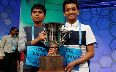 Co-champions Nihar Saireddy Janga and Jairam Jagadeesh Hathwar hold their trophy upon completion of the final round of Scripps National Spelling Bee at National Harbor in Maryland