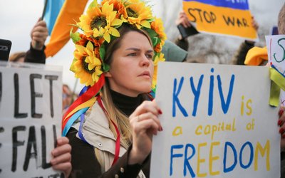 Protesters hold placards during the demonstration against