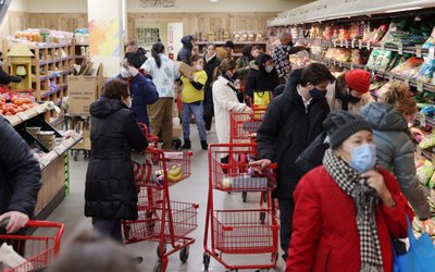 People shop in a grocery store in Manhattan, New York City