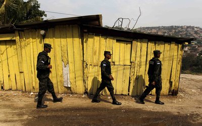 Members of the PMOP patrol the impoverished Flor del Campo neighbourhood in Tegucigalpa
