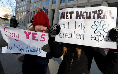 Net neutrality advocates rally in front of the Federal Communications Commission in Washington