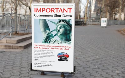 A sign announcing the closure of the Statue of Liberty, due to the U.S. government shutdown, sits near the ferry dock to the Statue of Liberty at Battery Park in Manhattan