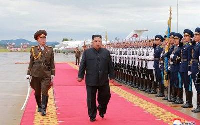 North Korea's leader Kim Jong Un attends a welcoming ceremony after arriving in Singapore
