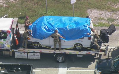 A van which was seized during an investigation into a series of parcel bombs is transported to an FBI facility in Miramar