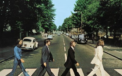 Members of the Beatles cross Abbey Road in London