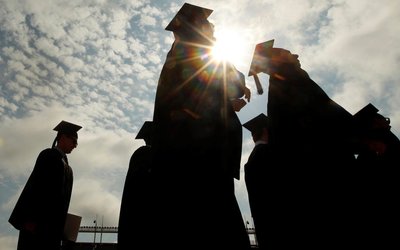 FILE PHOTO: Graduating students arrive for Commencement Exercises at Boston College in Boston