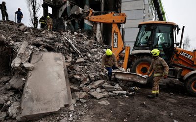 Search for bodies under the rubble of a building destroyed by Russian shelling, in Borodyanka
