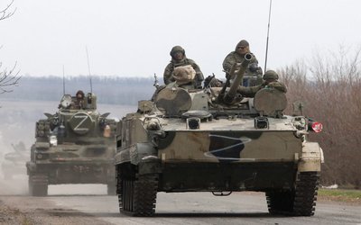 An armoured convoy of pro-Russian troops drives outside Mariupol