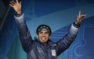 Silver medallist Ohno of the U.S. celebrates during the medal ceremony for the men's 1500 metres short track speed skating competition at the Vancouver 2010 Winter Olympics