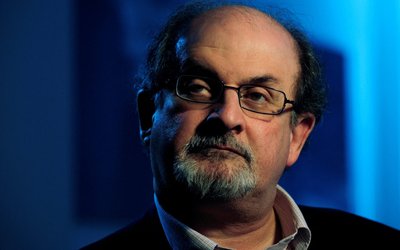 FILE PHOTO: British author Salman Rushdie listens during an interview with Reuters in London