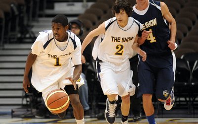 From left, Isiah Cooper of Montbello, Dominic Lopez of Colorado School for Deaf & Blind and Cade Kloster of Longmont are in the High School boys all-star basketball game at Pepsi Center on Saturday. April 9, 2011. Hyoung Chang/ The Denver Post