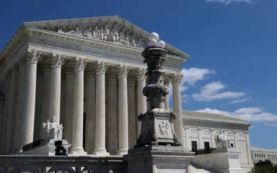 FILE PHOTO: A police officer is seen in front of the U.S. Supreme Court building in Washington