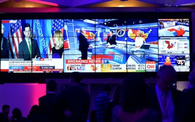 People watch the television coverage of the U.S. Presidential election results during an election party at the U.S. embassy in London