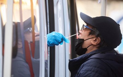 A man is given a coronavirus disease (COVID-19) test at pop-up testing site in New York