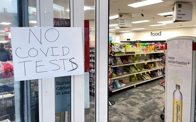 A hand written sign reads "No Covid Tests" in Somerville