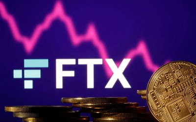 FILE PHOTO: FILE PHOTO: FILE PHOTO: Illustration shows FTX logo, stock graph and representation of cryptocurrencies