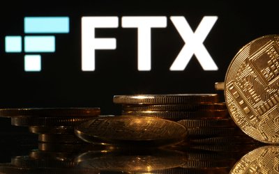 Illustration shows FTX logo and representation of cryptocurrencies