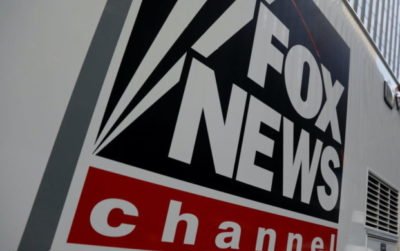 FILE PHOTO: A Fox News channel sign is seen on a television vehicle outside the News Corporation building in New York City, in New York