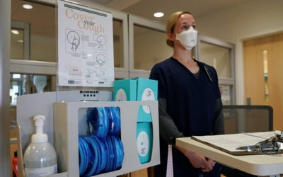 Staff nurse Lt. Gretta Walter awaits the arrival of coronavirus test patients in the emergency room at Fort Belvoir Community Hospital in Fort Belvoir