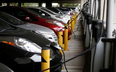 FILE PHOTO: Electric cars sit charging in a parking garage at the University of California, Irvine