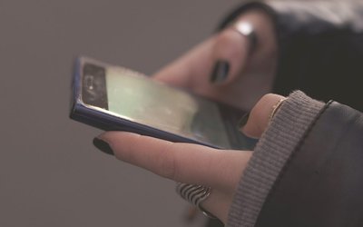 hands-smartphone-surveillance-AdobeStock_99865559-1024x678