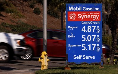 Gas prices grow along with inflation as this sign at a gas station shows in Solana Beach, California