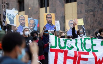 Protesters march for George Floyd on the day of opening statements for the trial of Chauvin in Minneapolis