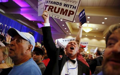 Trump supporters celebrate the close of the polls as they watch election results at a rally in Spartanburg, South Carolina