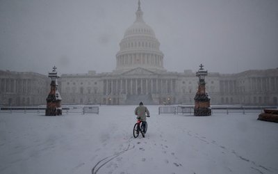 Snow falls during a winter storm on Capitol Hill, in Washington