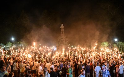 FILE PHOTO: FILE PHOTO: White nationalists participate in a torch-lit march on the grounds of the University of Virginia ahead of the Unite the Right Rally in Charlottesville, Virginia