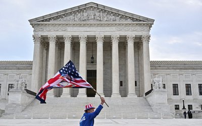 Supporters of those arrested in the January 6, 2021 attack on the U.S. Capitol protest between the U.S. Supreme Court and the Capitol in Washington
