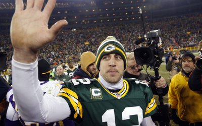 Green Bay Packers quarterback Aaron Rodgers waves to fans after defeating the Minnesota Vikings in their NFL NFC wildcard playoff football game in Green Bay