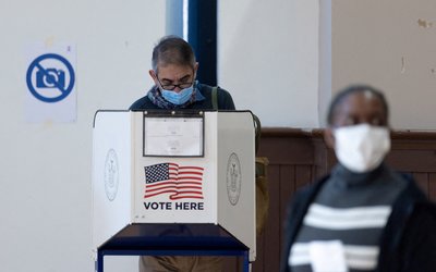 FILE PHOTO: Voters cast their ballots at a polling station during early voting in New York City