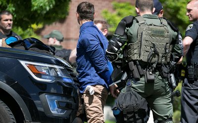 Group of men arrested after they were found in the rear of a U Haul van in Coeur d'Alene